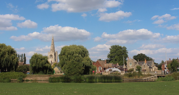 Village scene of Godmanchester, Cambridgeshire, with church, recreation ground and Chinese bridge