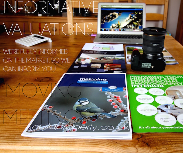 Property advice brochures, camera and laptop for informative valuations