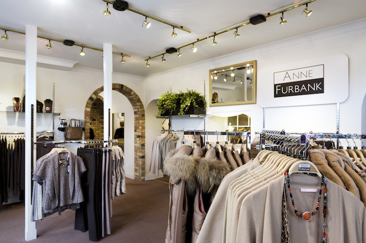Inside shop at Anne Furbank in Buckden with clothes rails, jackets, cardigans