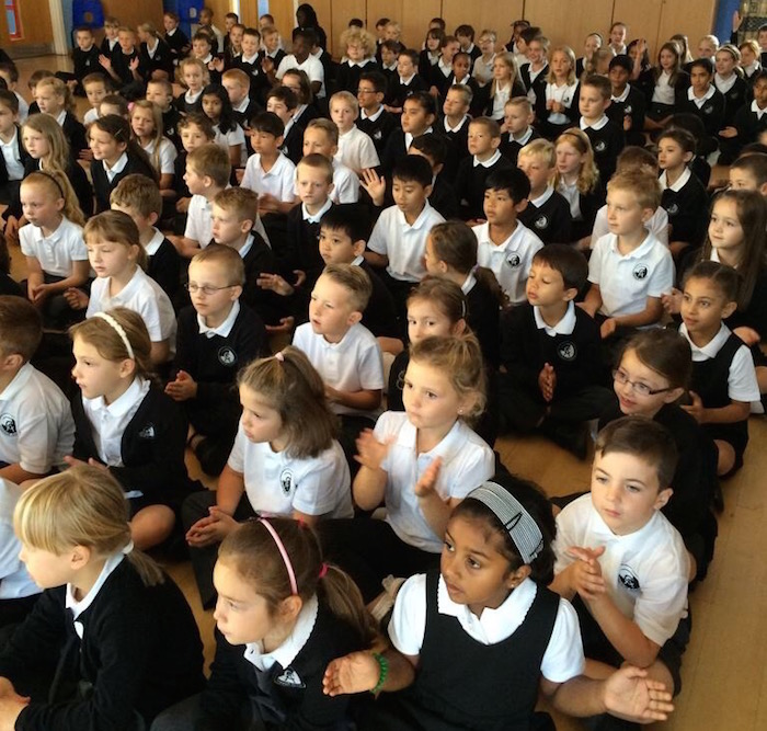 a picture of children taking part in assembly at Cromwell Academy