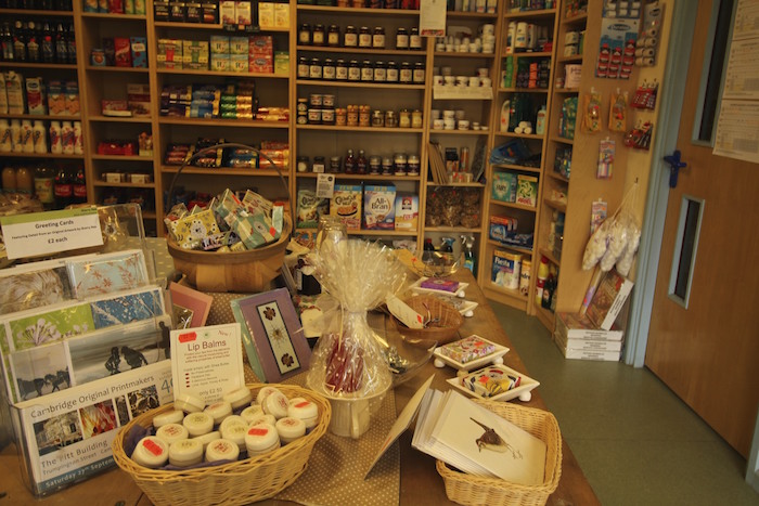 Village shop interior with convenience foods and handmade crafts