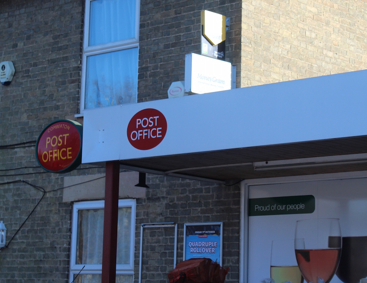 Exterior of convenience store with Post Office sign
