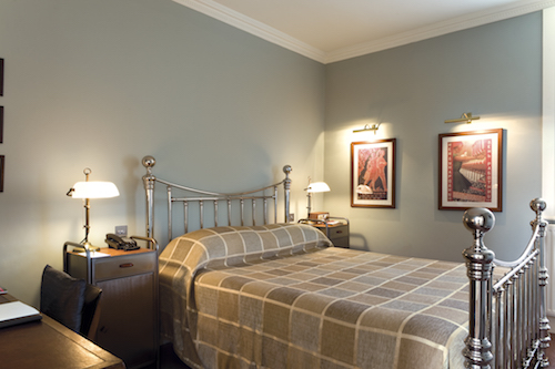 bedroom at The George Hotel with bedside cabinets, lights and pictures